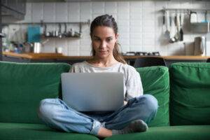 young woman on laptop online