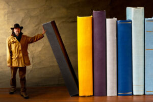 cowboy holding up books