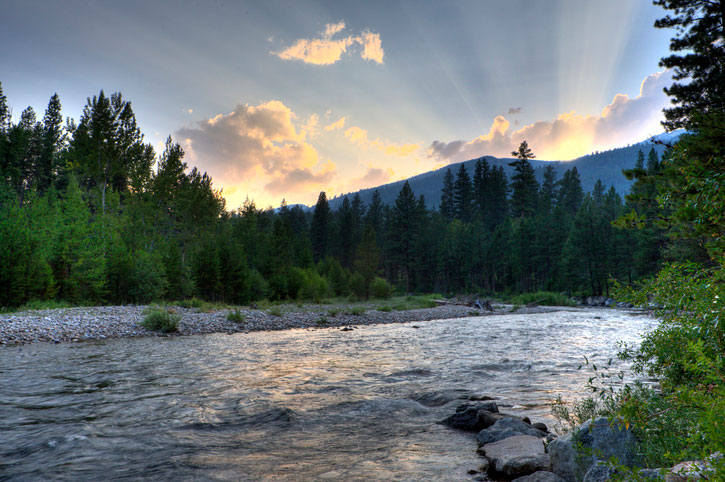 morning sun rays over the river in montana