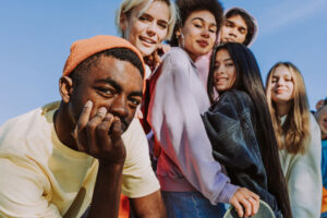 multicultural friends together on campus