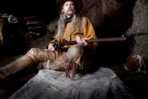 old western hunter with rifle