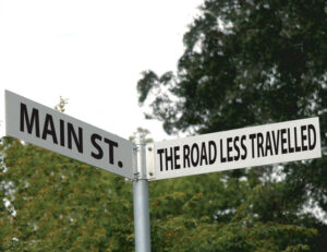 road less traveled sign