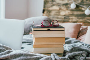 stack of books and glasses