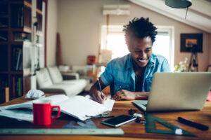 student studying in attic bedroom