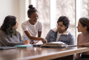 university students helping each other